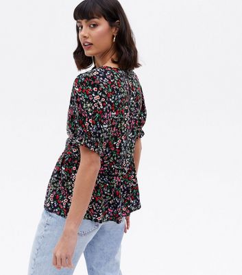 Click to view product details and reviews for Black Ditsy Floral Puff Sleeve Peplum Blouse New Look.