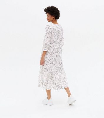 Click to view product details and reviews for White Ditsy Floral Seersucker Collared Midi Smock Dress New Look.