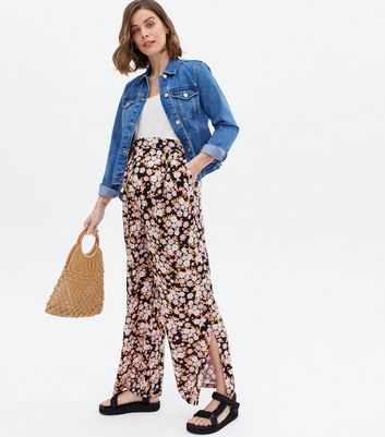 Click to view product details and reviews for Maternity Black Floral Split Hem Over Bump Wide Leg Trousers New Look.