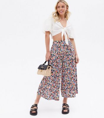 Click to view product details and reviews for Petite Black Floral Wide Leg Crop Trousers New Look.