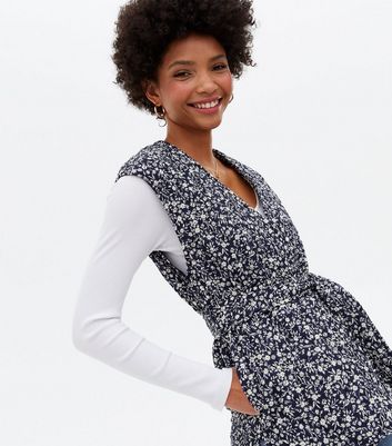 Click to view product details and reviews for Blue Floral Quilted Sleeveless Wrap Belted Jacket New Look.