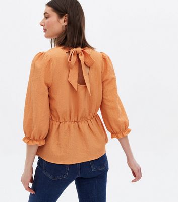 Bright Orange Textured Tie Back Peplum Blouse New Look