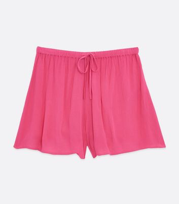 Click to view product details and reviews for Bright Pink Crinkle Tie Waist Beach Shorts New Look.