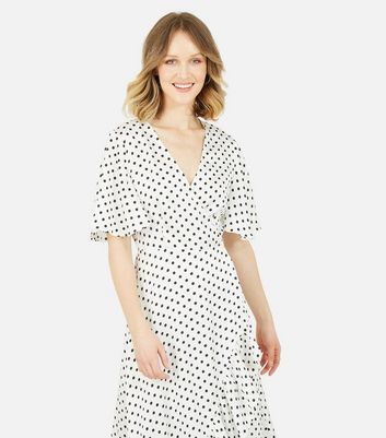 Click to view product details and reviews for Mela White Spot Asymmetric Frill Midi Wrap Dress New Look.