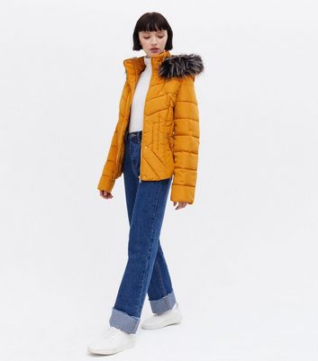 Click to view product details and reviews for Blue Vanilla Mustard Fitted Faux Fur Hooded Puffer Jacket New Look.