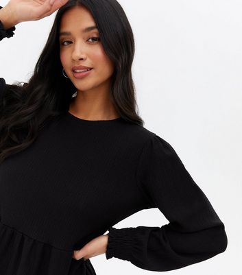 Click to view product details and reviews for Petite Black Crinkle Jersey Long Sleeve Mini Oversized Smock Dress New Look.