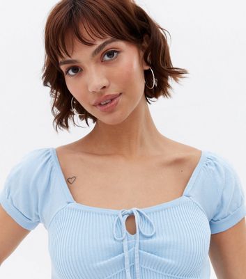 Click to view product details and reviews for Pale Blue Ribbed Knit Tie Front Crop Corset Top New Look.
