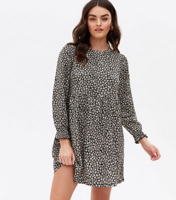 Click to view product details and reviews for Black Ditsy Floral Crinkle Jersey Mini Smock Dress New Look.