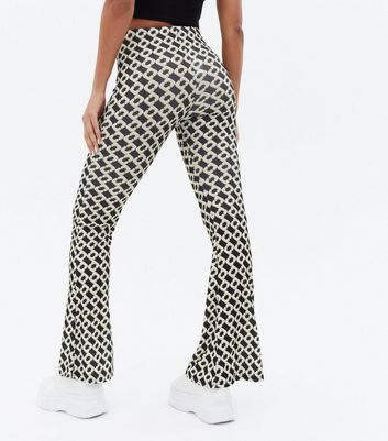 Click to view product details and reviews for Black Abstract High Waist Flared Trousers New Look.