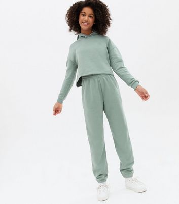 green hoodie and sweatpants set