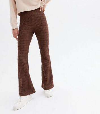 Click to view product details and reviews for Dark Brown Textured Flared Trousers New Look.