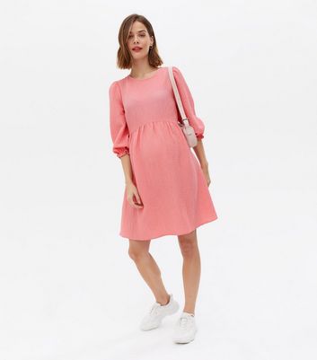 Click to view product details and reviews for Maternity Mid Pink Textured Tie Back Mini Smock Dress New Look.