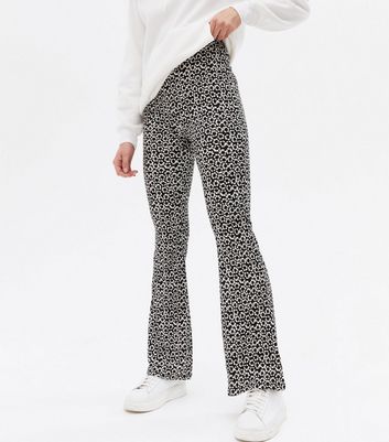 Click to view product details and reviews for Black Floral Crinkle Flared Trousers New Look.