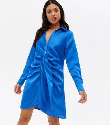 Click to view product details and reviews for Petite Blue Satin Ruched Tie Front Mini Shirt Dress New Look.