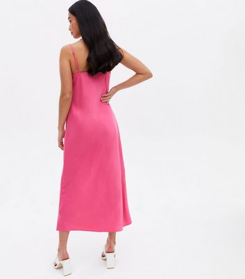 Click to view product details and reviews for Petite Bright Pink Satin Cowl Neck Midi Slip Dress New Look.