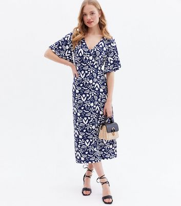 Click to view product details and reviews for Blue Vanilla Navy Leaf Tie Back Midi Dress New Look.