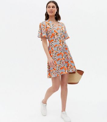 Click to view product details and reviews for Blue Vanilla Blue Floral Flutter Sleeve Mini Wrap Dress New Look.