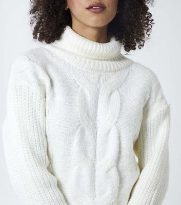 white roll neck cable knit jumper