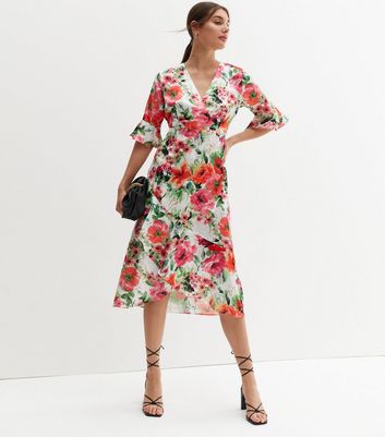 Click to view product details and reviews for Zibi London White Floral Midi Wrap Dress New Look.