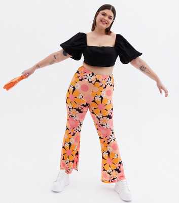 Psychedelic Curves Orange Floral Flared Trousers