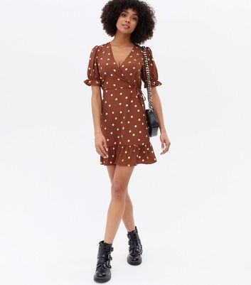 Click to view product details and reviews for Brown Spot Frill Mini Wrap Dress New Look.