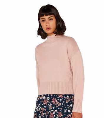 Click to view product details and reviews for Apricot Pink High Neck Crop Jumper New Look.