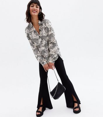 Click to view product details and reviews for White Leopard Print Long Sleeve Oversized Shirt New Look.