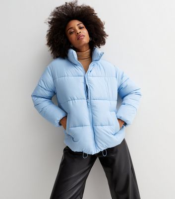 Pale blue puffer jacket on sale