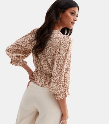 Click to view product details and reviews for Brown Ditsy Floral Ruched Tie Front Peplum Blouse New Look.