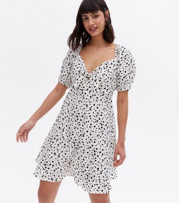 Click to view product details and reviews for White Spot Crepe Tie Front Mini Dress New Look.