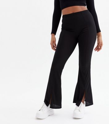 Click to view product details and reviews for Black Ribbed Split Front Flared Trousers New Look.