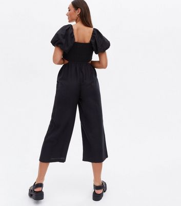 black jumpsuit with cutout sides