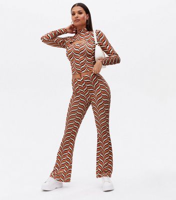 Click to view product details and reviews for Cameo Rose Brown Geometric Jersey Flared Trousers New Look.