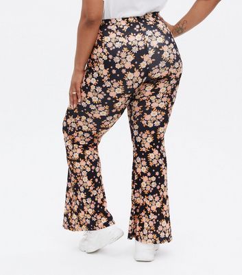 Click to view product details and reviews for Curves Black Floral Ribbed Flared Trousers New Look.