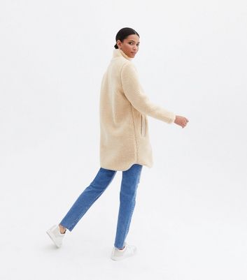 Click to view product details and reviews for Cream Teddy High Neck Zip Front Long Jacket New Look.