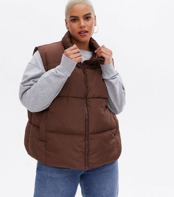 Click to view product details and reviews for Curves Dark Brown Crop High Neck Boxy Gilet New Look.