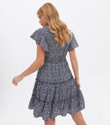 Click to view product details and reviews for Blue Vanilla Navy Ditsy Floral Shirred Tiered Mini Dress New Look.