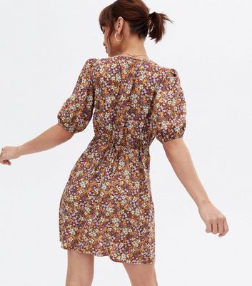 Click to view product details and reviews for Brown Floral Button Side Mini Wrap Dress New Look.