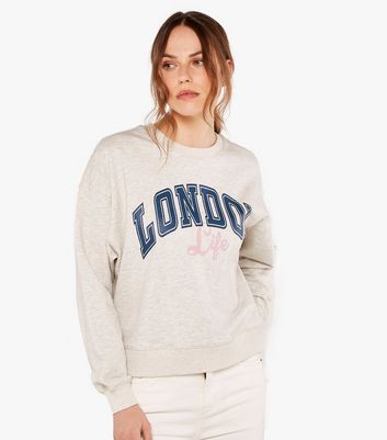 Click to view product details and reviews for Apricot Cream London Life Logo Sweatshirt New Look.