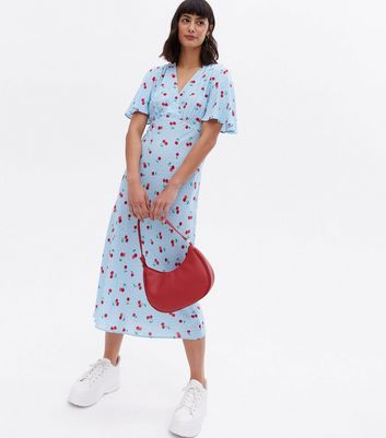 Click to view product details and reviews for Blue Cherry Spot Midi Wrap Dress New Look.