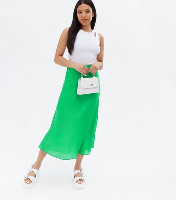 Click to view product details and reviews for Petite Green Satin Bias Cut Midi Skirt New Look.