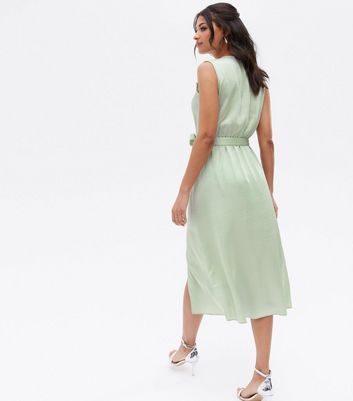 Click to view product details and reviews for Light Green Satin Sleeveless Ruffle Midi Wrap Dress New Look.