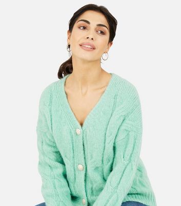 Click to view product details and reviews for Yumi Light Green Chunky Cable Knit Cardigan New Look.