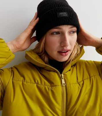 Black Ribbed Knit Tab Front Beanie