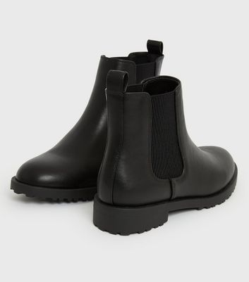 black cleated chelsea boots