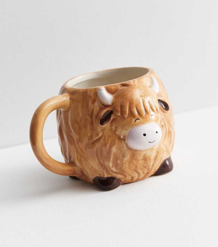 https://media3.newlookassets.com/i/newlook/839393229/home-living/brown-highland-cow-mug.jpg?strip=true&qlt=50&w=720