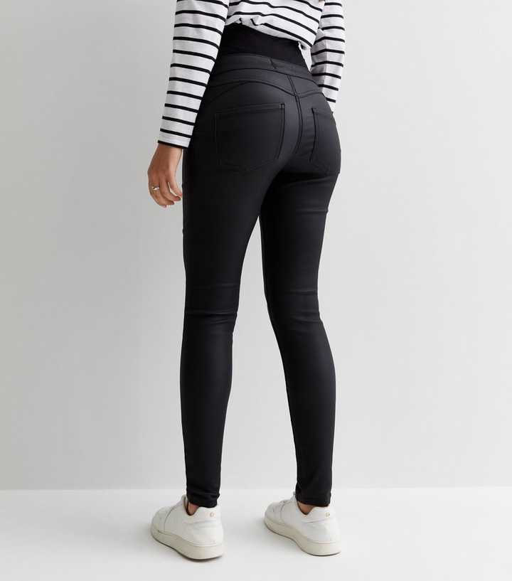 https://media3.newlookassets.com/i/newlook/839662801M3/womens/clothing/jeans/maternity-black-coated-over-bump-lift-shape-emilee-jeggings.jpg?strip=true&qlt=50&w=720