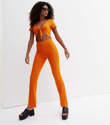 bright orange trousers