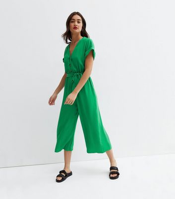 green jumpsuit with buttons