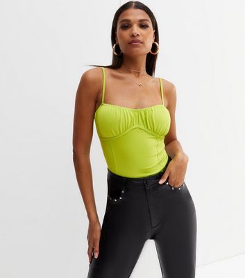 green corset body suit